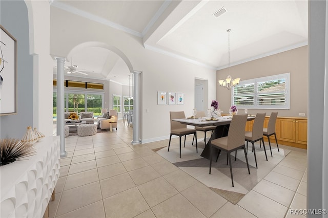 tiled dining space with decorative columns, a healthy amount of sunlight, ceiling fan with notable chandelier, and ornamental molding