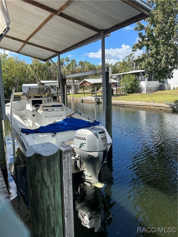 dock area with a water view