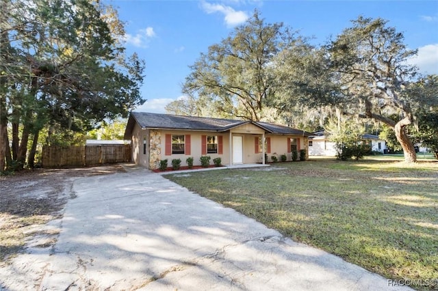 ranch-style house with a front lawn