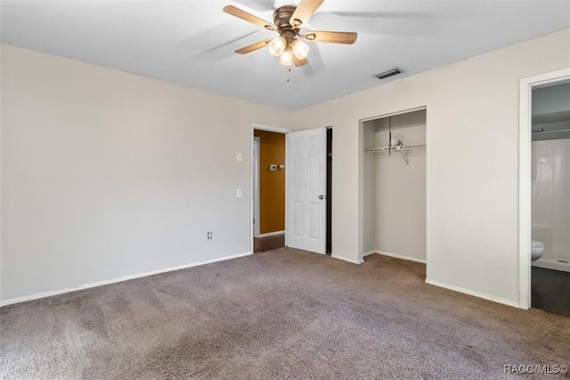 9780 W Tennessee Ln, Crystal River, FL 34428 - unfurnished bedroom with connected bathroom, ceiling fan, a closet, and carpet floors
