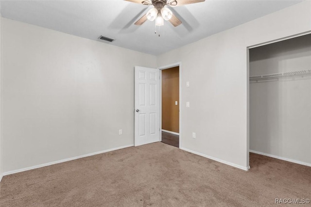 9780 W Tennessee Ln, Crystal River, FL 34428 - unfurnished bedroom with carpet floors, a closet, and ceiling fan