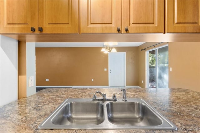 9780 W Tennessee Ln, Crystal River, FL 34428 - kitchen with a notable chandelier and sink