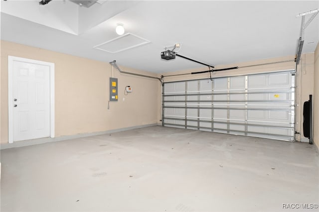 garage with electric panel and a garage door opener