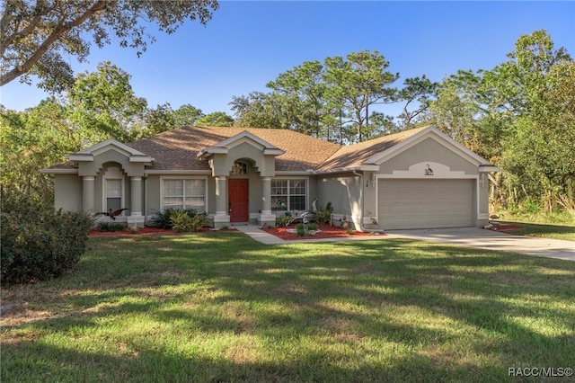 ranch-style home with a garage and a front yard