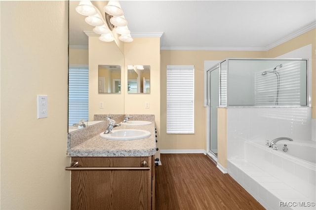 bathroom with hardwood / wood-style flooring, independent shower and bath, crown molding, and a notable chandelier