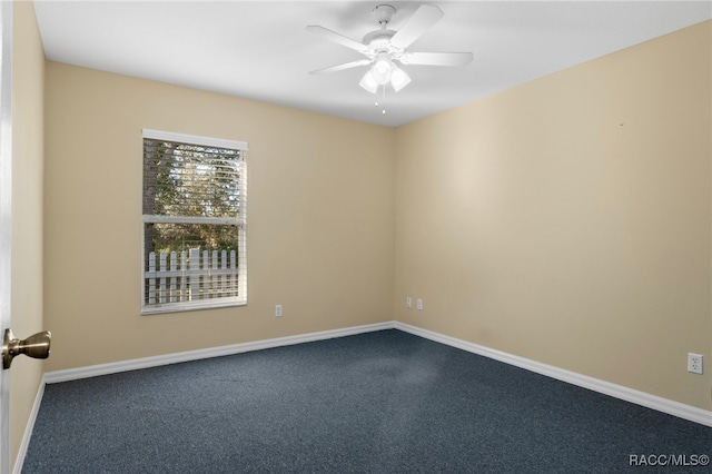 carpeted empty room featuring ceiling fan