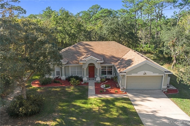 view of front facade with a front lawn and a garage