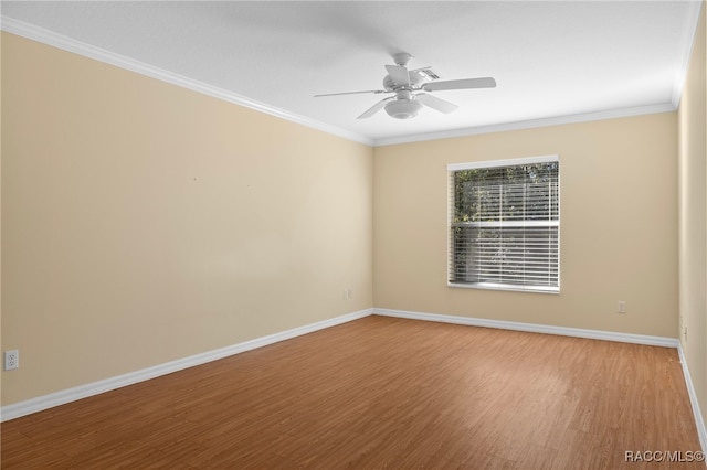 unfurnished room featuring ceiling fan, hardwood / wood-style floors, and ornamental molding