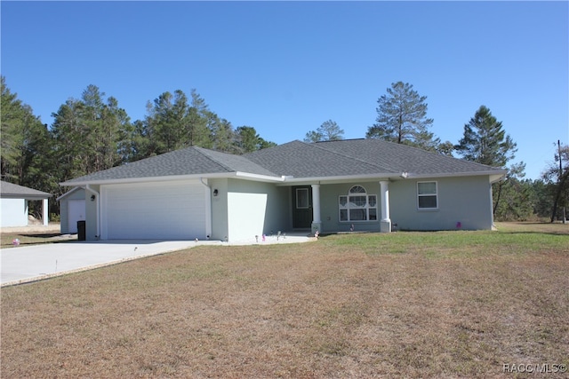 ranch-style home featuring a garage and a front lawn