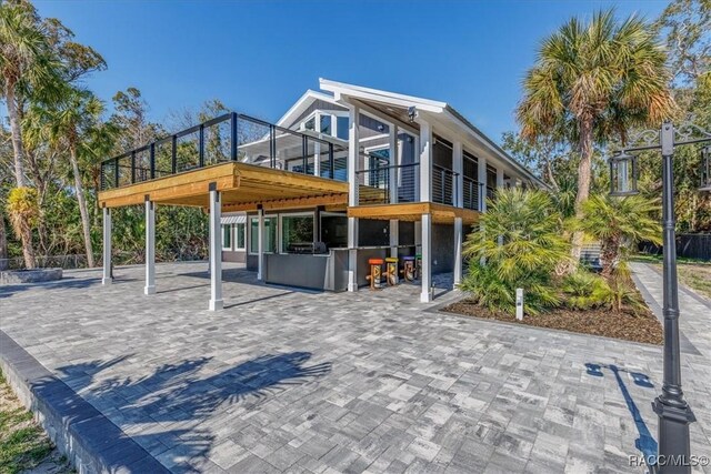 exterior space featuring exterior bar and a patio