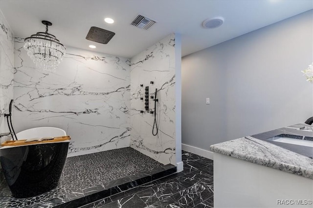 bathroom with a chandelier, plus walk in shower, and vanity