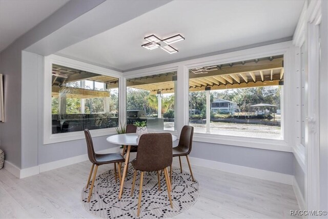 dining room with light wood-type flooring and ceiling fan