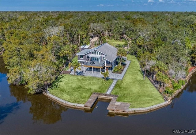 aerial view with a wooded view and a water view