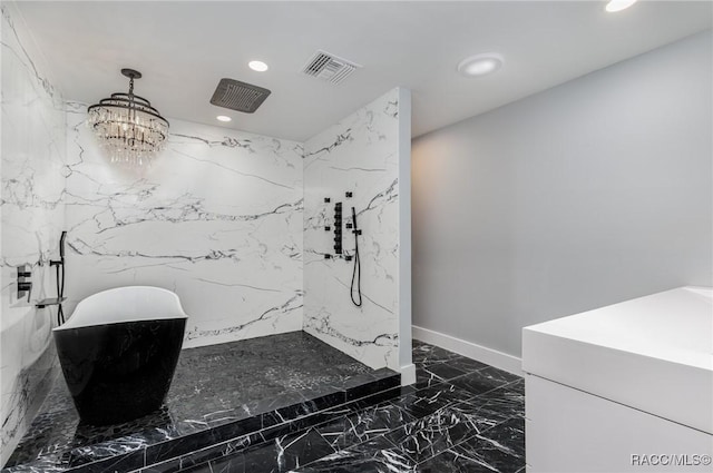 bathroom featuring a chandelier and independent shower and bath