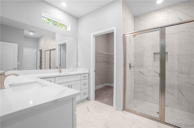 full bath with vanity, marble finish floor, baseboards, recessed lighting, and a stall shower