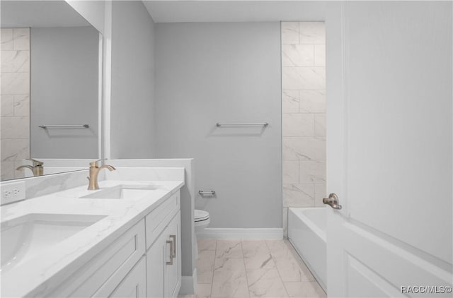 bathroom featuring double vanity, a sink, marble finish floor, and toilet