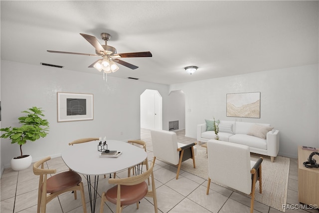 dining room with ceiling fan and light tile patterned flooring