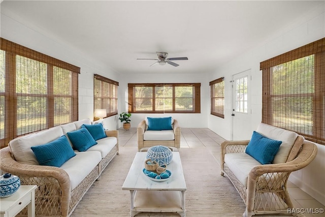 sunroom featuring ceiling fan