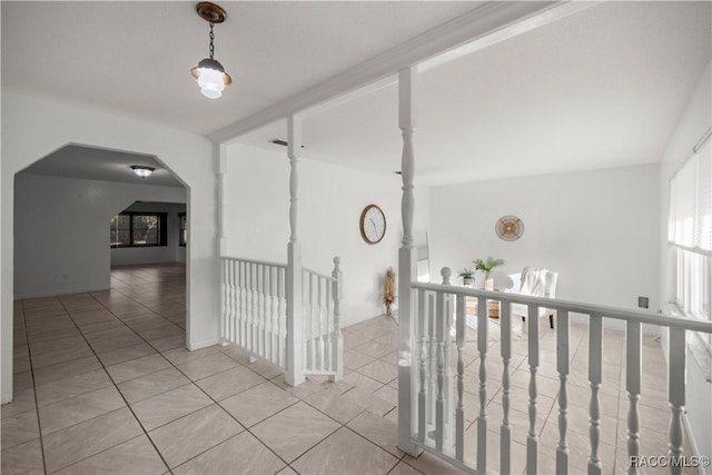 corridor featuring light tile patterned flooring