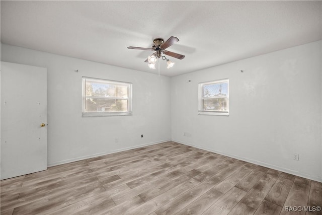 empty room featuring light hardwood / wood-style floors and ceiling fan