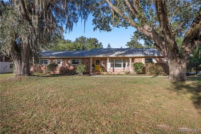 ranch-style house with a front lawn