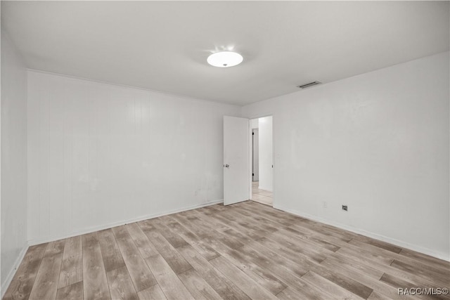 spare room with light wood-type flooring