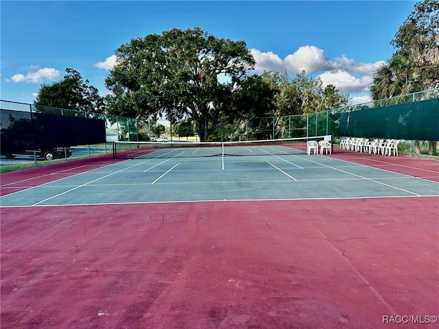 view of tennis court featuring basketball court