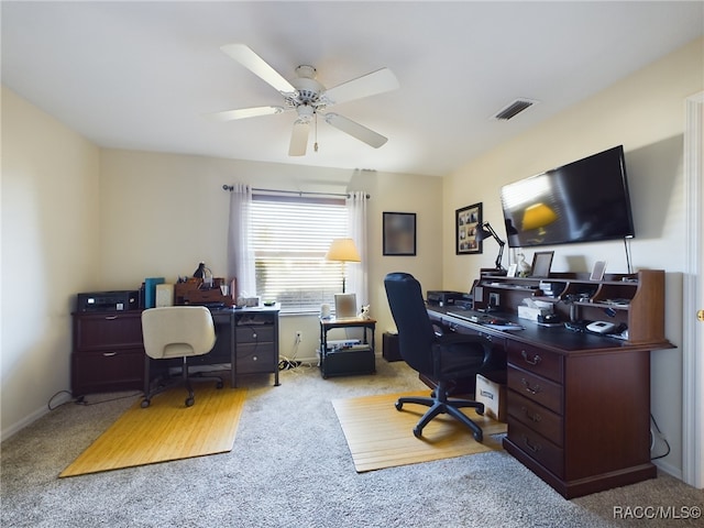 carpeted home office with ceiling fan