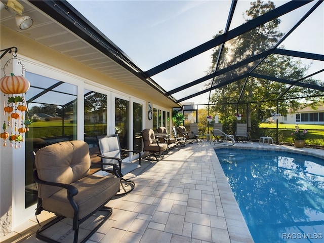 view of pool featuring a patio area and a lanai