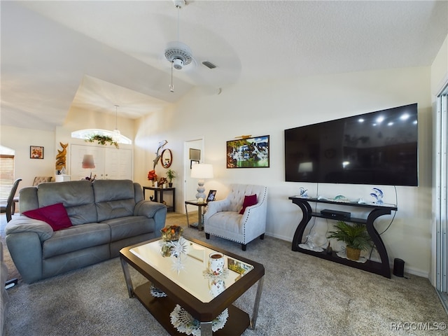 living room with carpet, vaulted ceiling, and ceiling fan