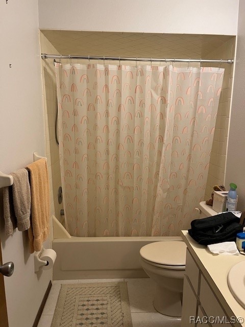 full bathroom featuring tile patterned flooring, vanity, toilet, and shower / tub combo with curtain