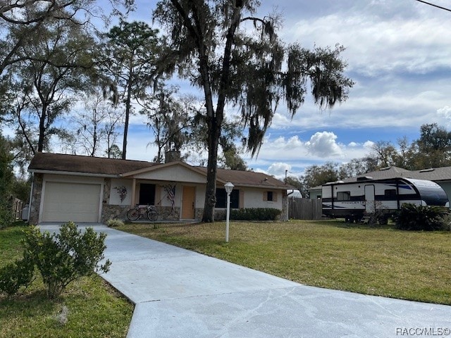 ranch-style house with a garage and a front lawn