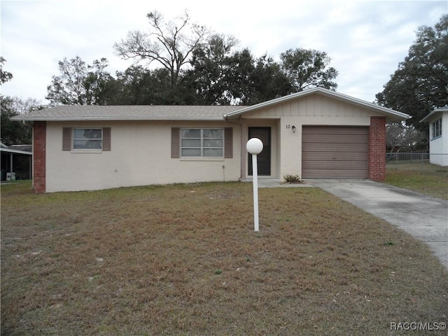 ranch-style house with a front yard and a garage