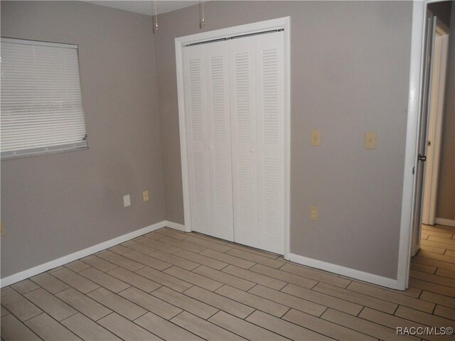 unfurnished bedroom featuring a closet