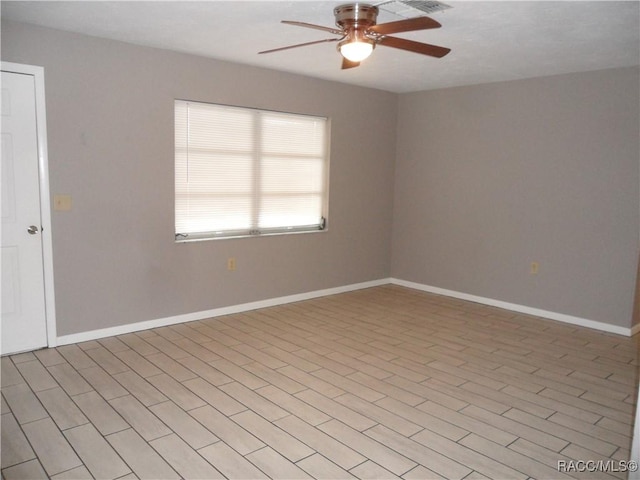 spare room featuring ceiling fan