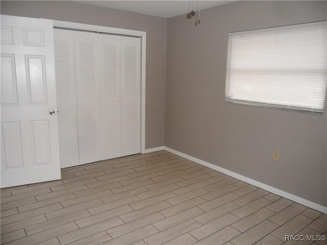 unfurnished bedroom with a closet