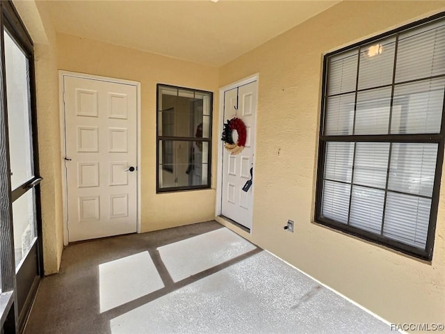 2058 Forest Dr, Inverness, FL 34453 - doorway to property featuring stucco siding