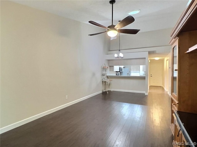 2058 Forest Dr, Inverness, FL 34453 - unfurnished living room with ceiling fan, dark wood finished floors, and baseboards
