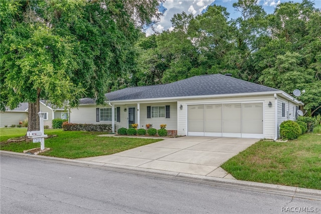 ranch-style home featuring a garage and a front lawn