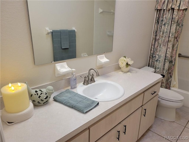 full bathroom with tile patterned flooring, shower / bath combo, toilet, and vanity