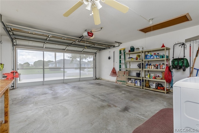 garage with washer / dryer, a garage door opener, and ceiling fan