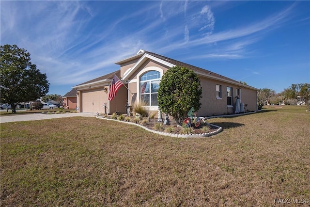 single story home with a front yard and a garage