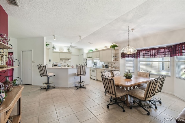 761 W Sunbird Path, Hernando, FL 34442 - dining space featuring light tile patterned floors, a textured ceiling, a chandelier, ceiling fan, and lofted ceiling