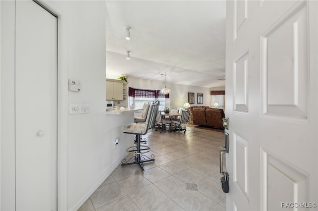 761 W Sunbird Path, Hernando, FL 34442 - hall featuring light tile patterned floors and a textured ceiling
