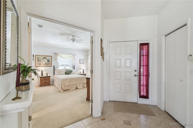 761 W Sunbird Path, Hernando, FL 34442 - entrance foyer with a ceiling fan, light tile patterned floors, and light carpet