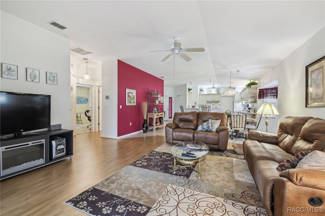 761 W Sunbird Path, Hernando, FL 34442 - living room featuring wood finished floors, a ceiling fan, and vaulted ceiling