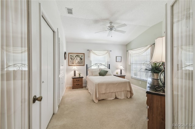 761 W Sunbird Path, Hernando, FL 34442 - bedroom featuring vaulted ceiling, light colored carpet, a textured ceiling, and a ceiling fan