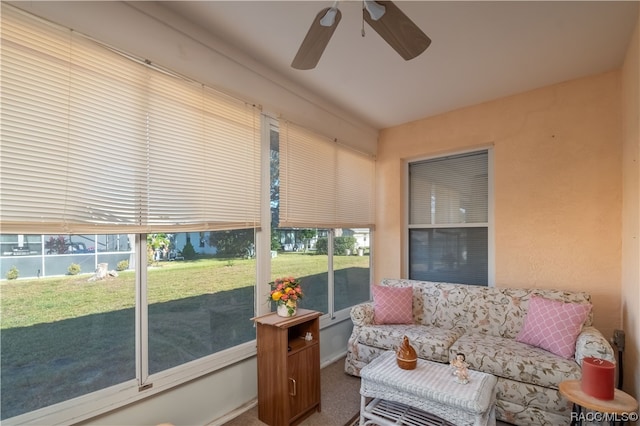 sunroom / solarium with a wealth of natural light and ceiling fan