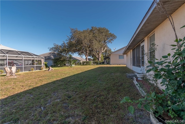 view of yard with a lanai