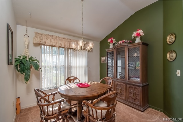 carpeted dining space with vaulted ceiling and a notable chandelier